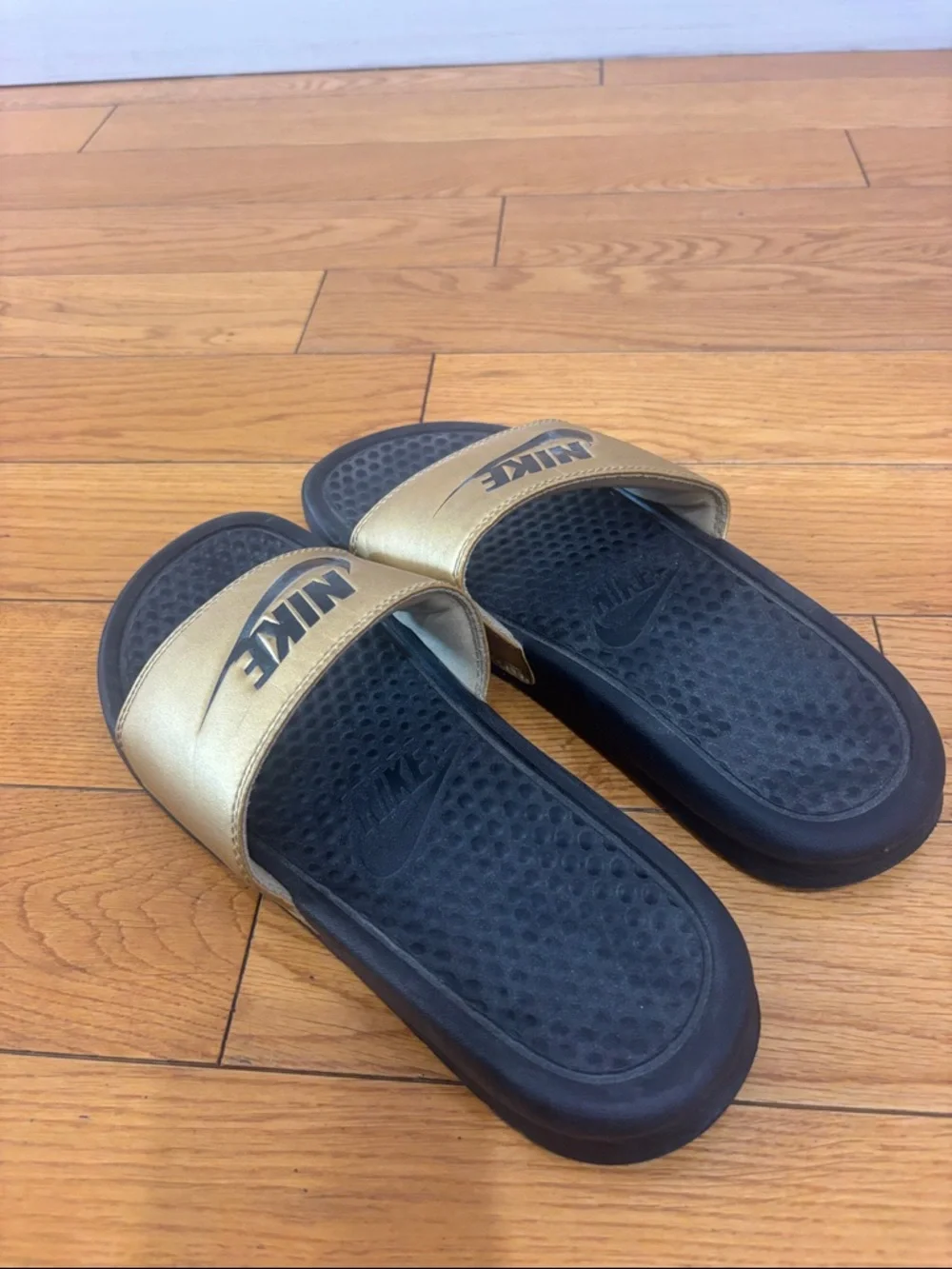 Nike Black and Gold Slide Sandals, women’s size 6